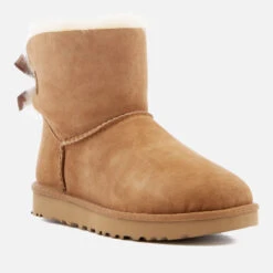 UGG Women's Mini Bailey Bow II Sheepskin Boots - Chestnut 9 UGG Women's Mini Bailey Bow II Sheepskin Boots - Chestnut -Vans || Clarks || Ugg Sales 11488816 9844525035236406