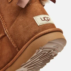 UGG Kids' Mini Bailey Bow Sheepskin Boots - Chestnut -Vans || Clarks || Ugg Sales 12614166 1054804157254251